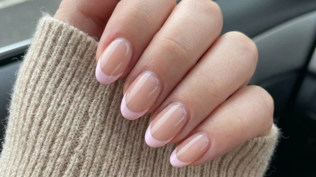 baby pink french tips - regrowth blending into sheer base