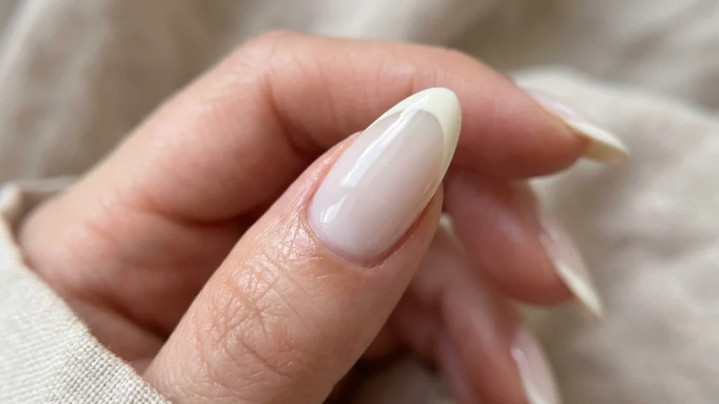 inished milky french manicure glossy close up