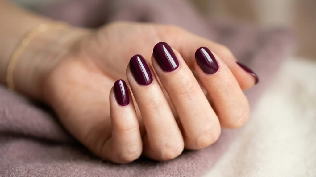 back to school nail colors - deep plum manicure close-up