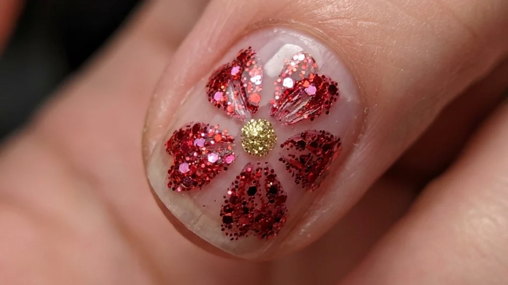 red floral glitter nail art - completing the flower petals