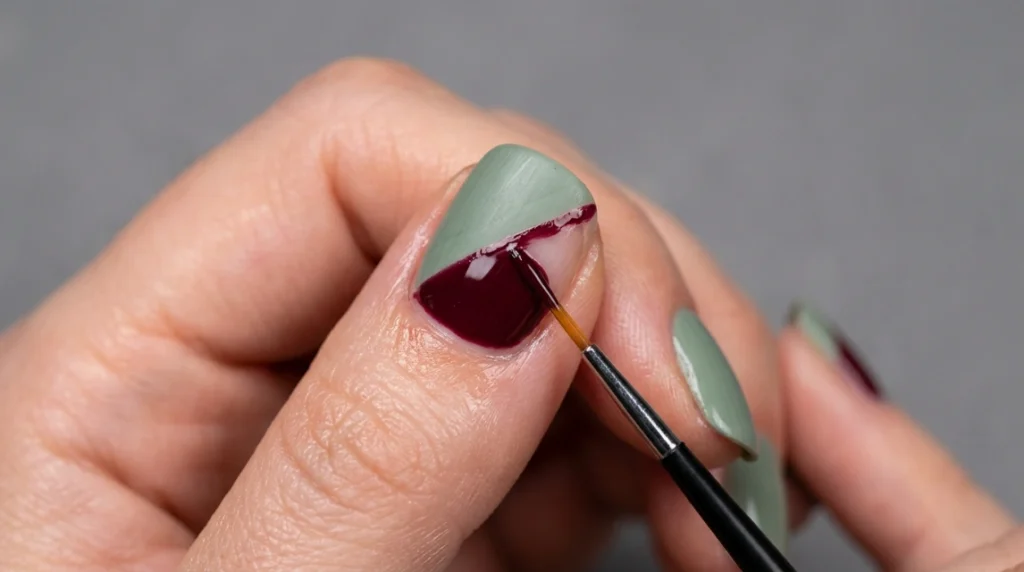 Burgundy polish filling the remaining diagonal tip space