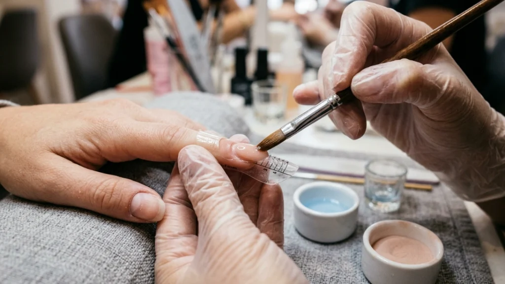 press on nails vs acrylics - acrylic application at salon