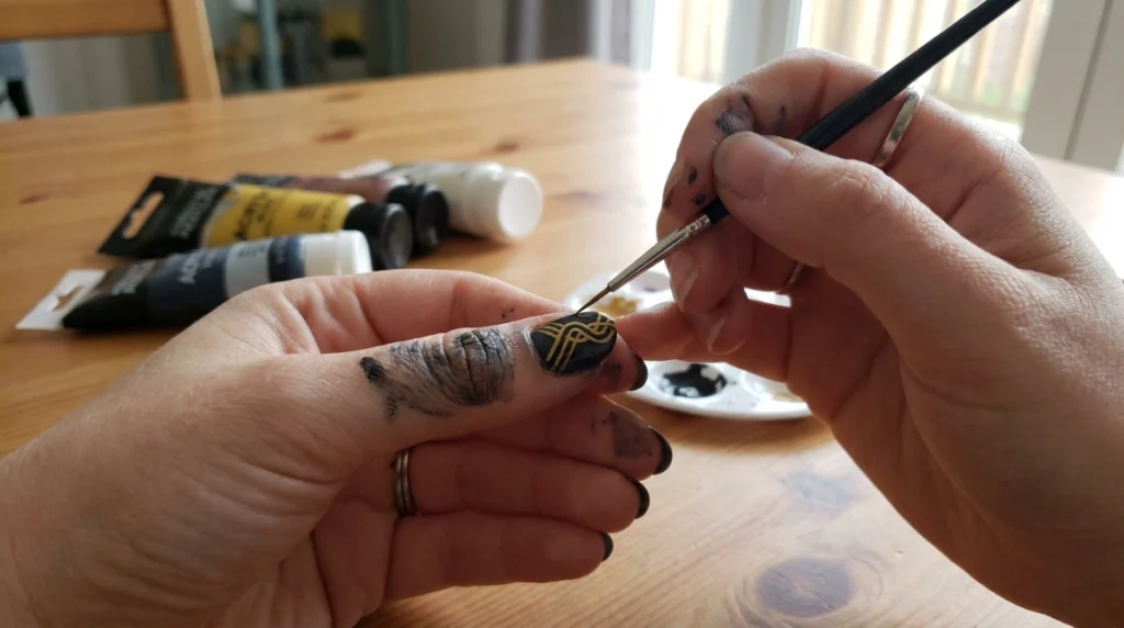 A fine nail-art brush adds the detail that makes each nail distinct